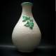 UGO ZACCAGNINI, vaso in ceramica a bulbo effetto bugnato, rametto verde in rilievo, h.cm.35x22, anni 50