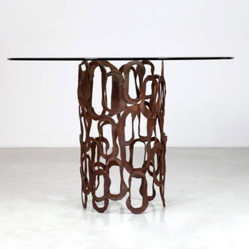 Angelo Rinaldi |Tavolo scultura |in ferro grezzo sagomato e patinato e cristallo| h. cm.80x120 | anni ’70