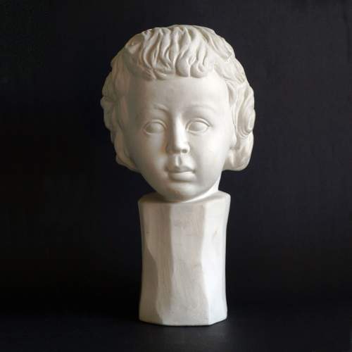    Biso Enzo,testa di  Fanciullo, scultura in bisquits,cm.29,5x 17x16